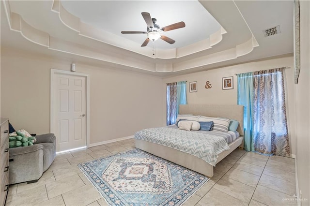 612 Persimmon Ave, Edinburg, TX 78539 - tiled bedroom with a tray ceiling and ceiling fan