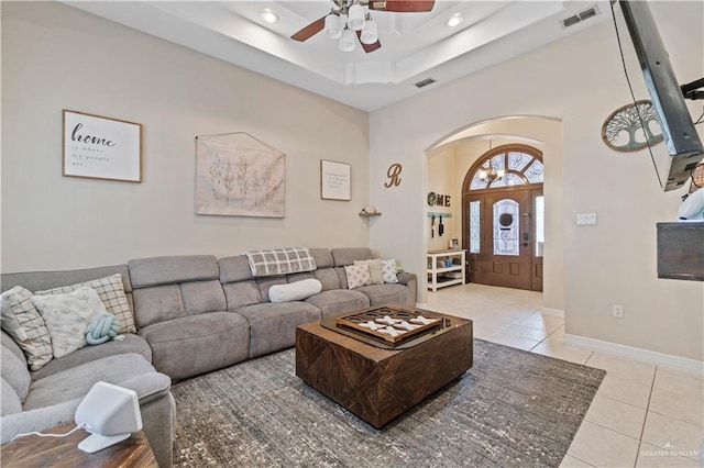 612 Persimmon Ave, Edinburg, TX 78539 - living room featuring a ceiling fan, arched walkways, light tile patterned floors, recessed lighting, and a raised ceiling