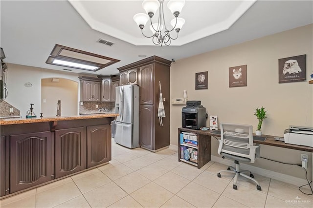 612 Persimmon Ave, Edinburg, TX 78539 - home office featuring a chandelier, a raised ceiling, and light tile patterned floors