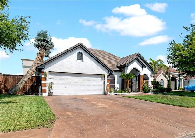 612 Persimmon Ave, Edinburg, TX 78539 - ranch-style home with a tiled roof, a garage, and driveway