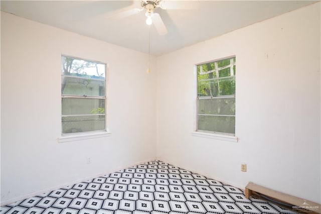 unfurnished room with ceiling fan