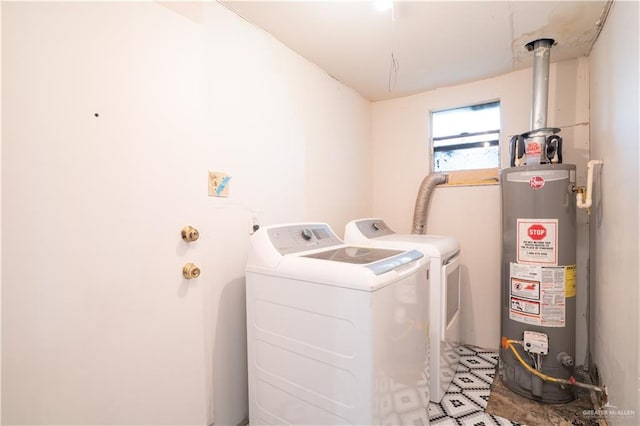 laundry room featuring washing machine and dryer and water heater