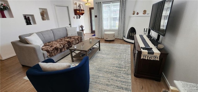 living room with light hardwood / wood-style floors