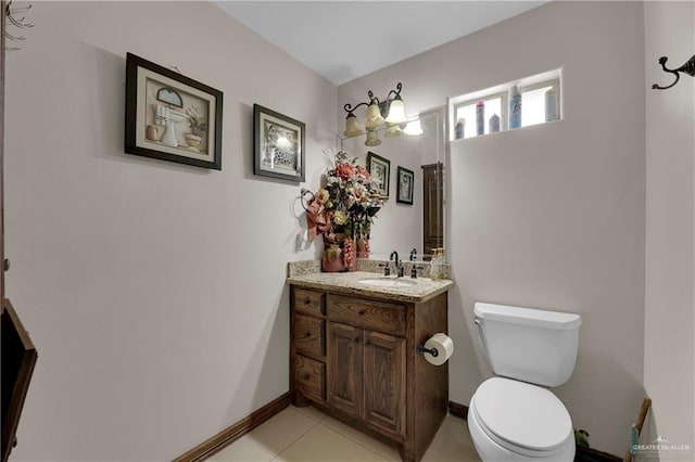 bathroom with tile patterned floors, vanity, and toilet