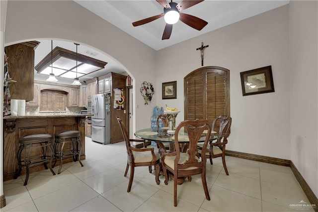 tiled dining room with ceiling fan