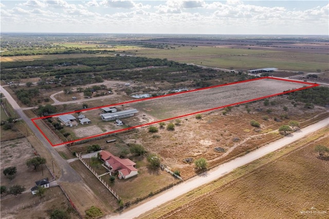 birds eye view of property featuring a rural view