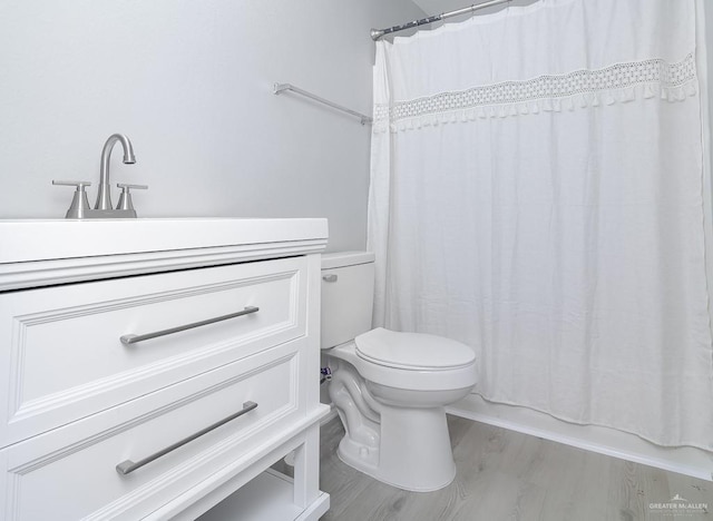 bathroom featuring shower / bath combo, toilet, and wood finished floors