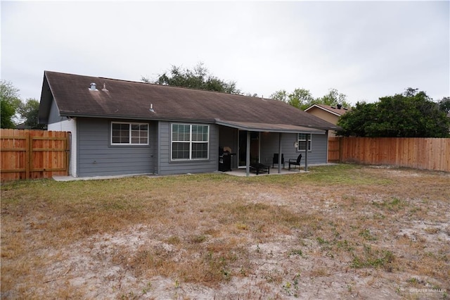 2405 Sundrop Ave, Mission, TX 78574 - rear view of property featuring a patio area