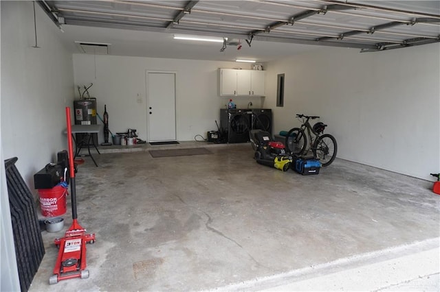 2405 Sundrop Ave, Mission, TX 78574 - garage with washer and clothes dryer and water heater