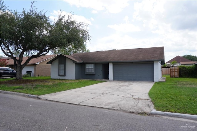 2405 Sundrop Ave, Mission, TX 78574 - ranch-style home featuring concrete driveway and an attached garage
