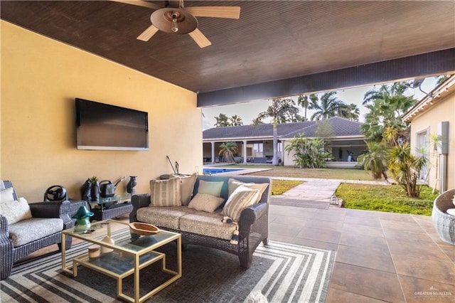 view of patio / terrace with a ceiling fan and an outdoor living space