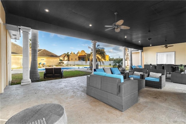 view of patio featuring a ceiling fan, an outdoor living space, and a fenced in pool