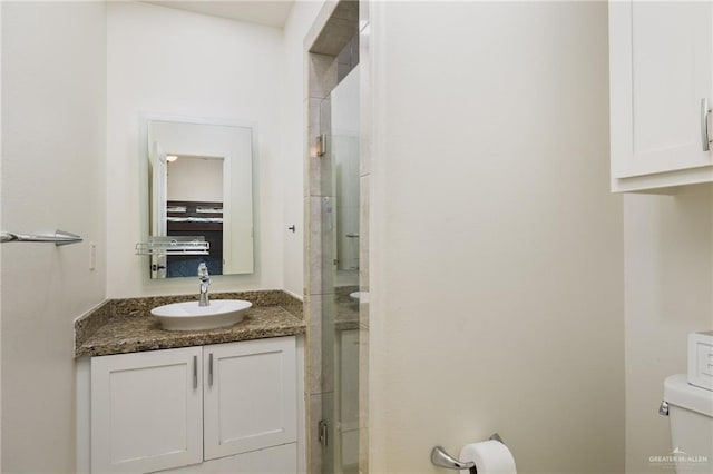 2803 Thompson St, Mission, TX 78573 - bathroom featuring toilet, vanity, and a shower with door