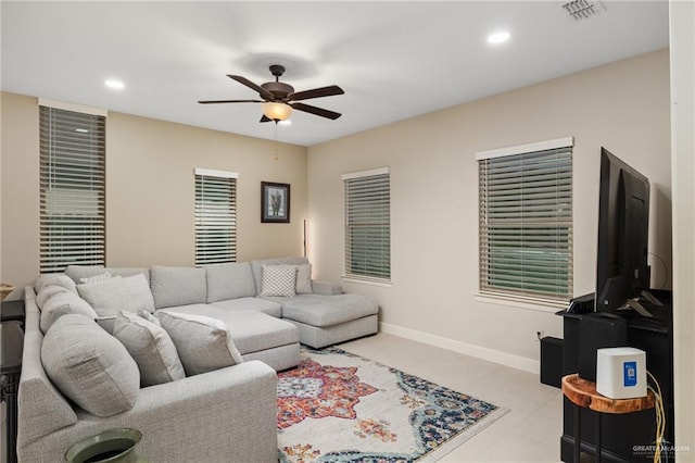 2803 Thompson St, Mission, TX 78573 - living room with ceiling fan, light tile patterned floors, recessed lighting, and baseboards