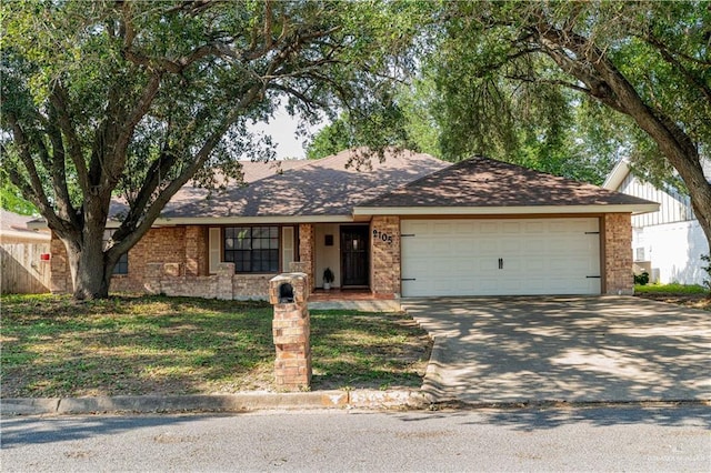 2105 Nightingale Ave W, Mcallen, TX 78504 - single story home featuring concrete driveway, a garage, and brick siding