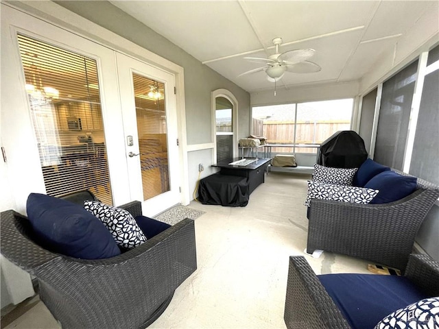 sunroom / solarium featuring ceiling fan