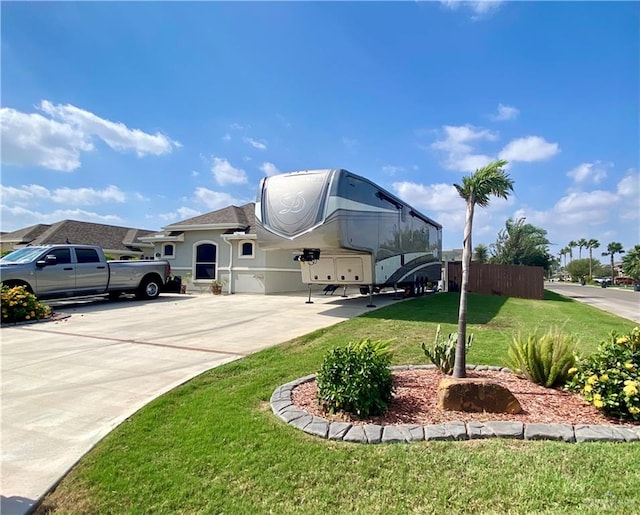 view of front of house with a front lawn and a garage