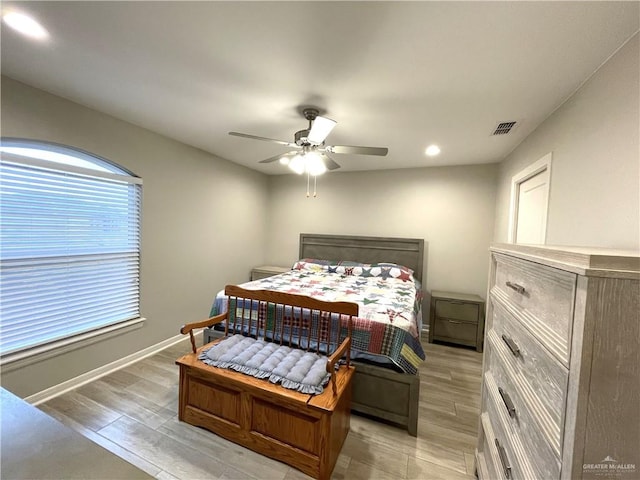 bedroom featuring light wood-type flooring and ceiling fan