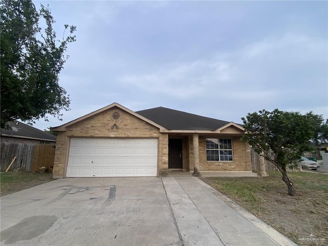 single story home featuring a garage, fence, concrete driveway, and brick siding