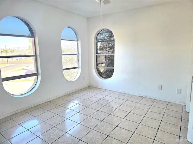 unfurnished room with light tile patterned floors