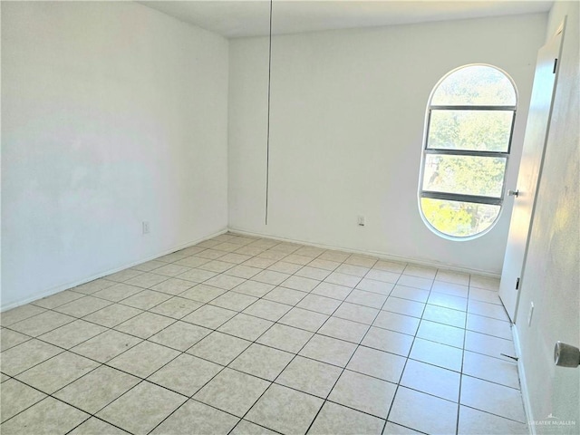 empty room featuring light tile patterned floors