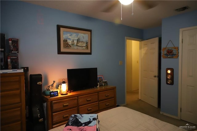 1811 Crown Pointe Blvd, Mission, TX 78572 - carpeted bedroom featuring a ceiling fan and visible vents