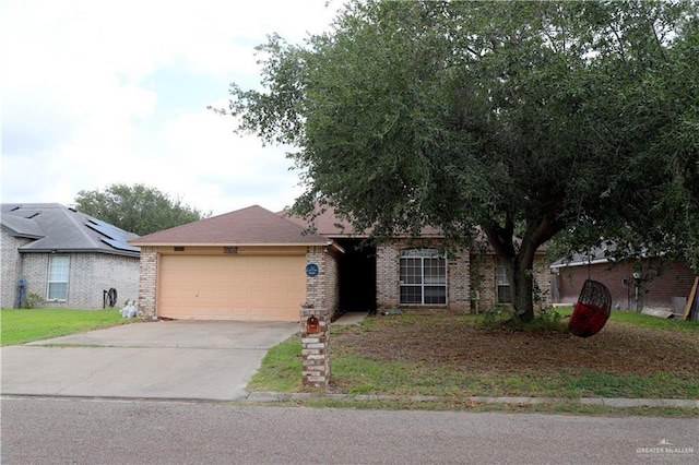 1811 Crown Pointe Blvd, Mission, TX 78572 - single story home with a garage, concrete driveway, and brick siding