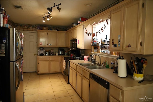 1811 Crown Pointe Blvd, Mission, TX 78572 - kitchen featuring visible vents, a sink, light countertops, light tile patterned floors, and stainless steel appliances