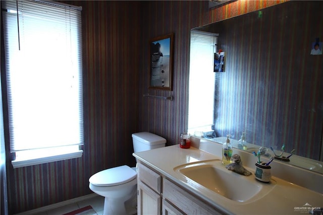 1811 Crown Pointe Blvd, Mission, TX 78572 - bathroom with toilet, wallpapered walls, and vanity