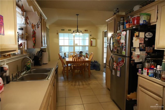 1811 Crown Pointe Blvd, Mission, TX 78572 - kitchen featuring a sink, light tile patterned floors, freestanding refrigerator, and light countertops