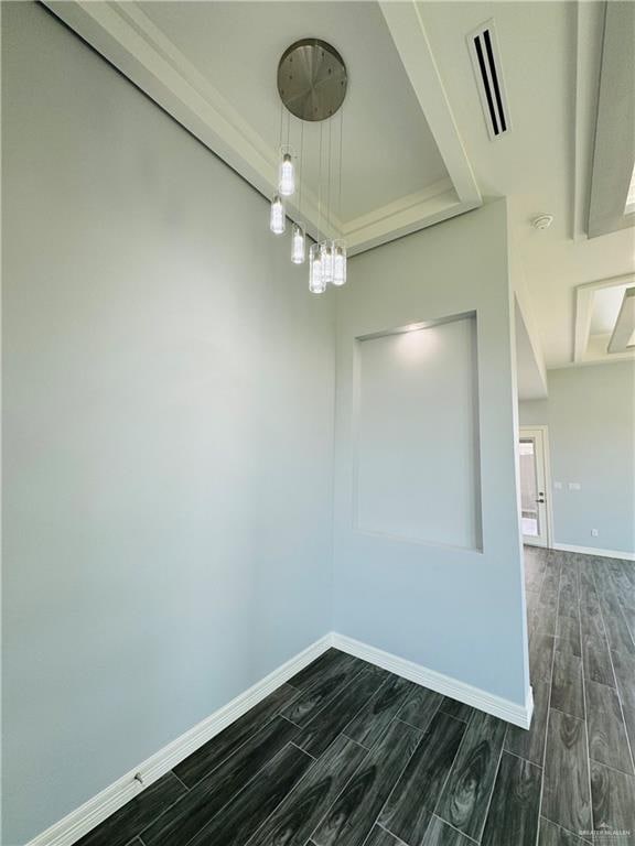 spare room featuring dark wood-type flooring