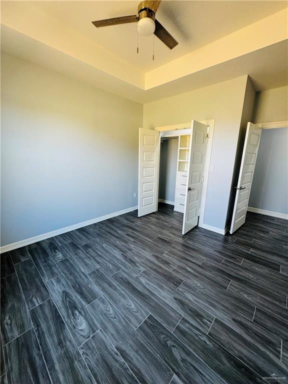 unfurnished bedroom featuring a closet and ceiling fan