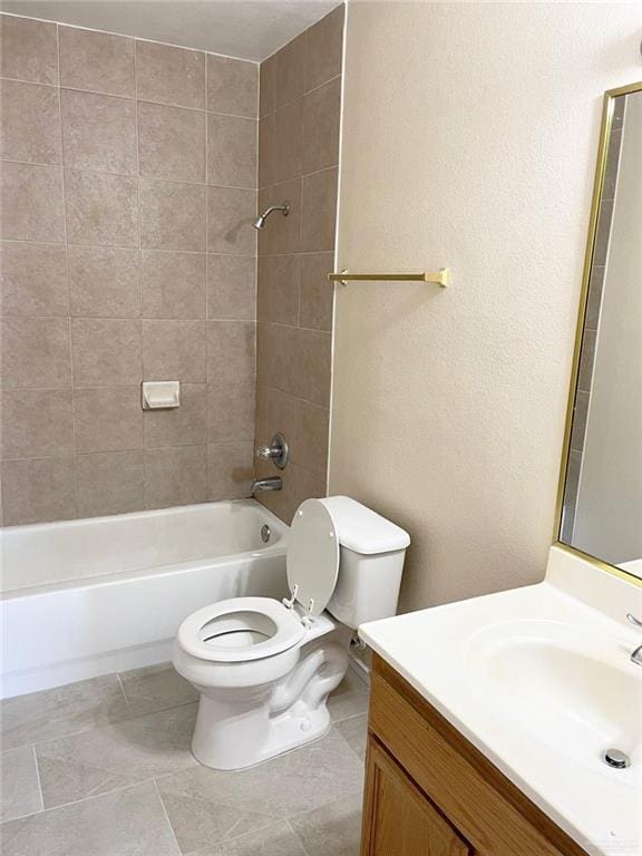 full bathroom with vanity, tiled shower / bath combo, toilet, and tile patterned flooring