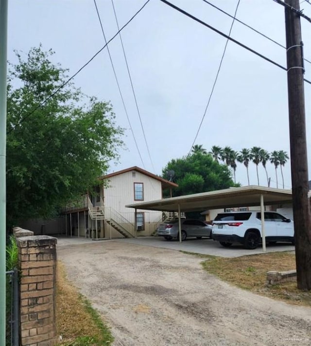 exterior space featuring a carport