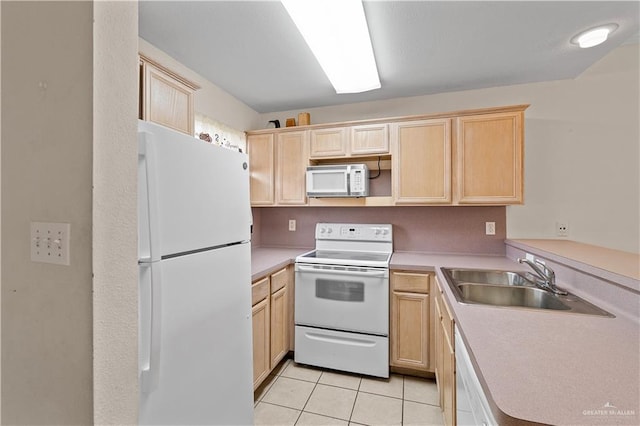 129 E Lantana St Unit 3, South Padre Island, TX 78597 - kitchen featuring light tile patterned flooring, light brown cabinets, white appliances, a sink, and light countertops