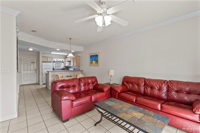 129 E Lantana St Unit 3, South Padre Island, TX 78597 - living area featuring light tile patterned floors, ornamental molding, visible vents, and a ceiling fan