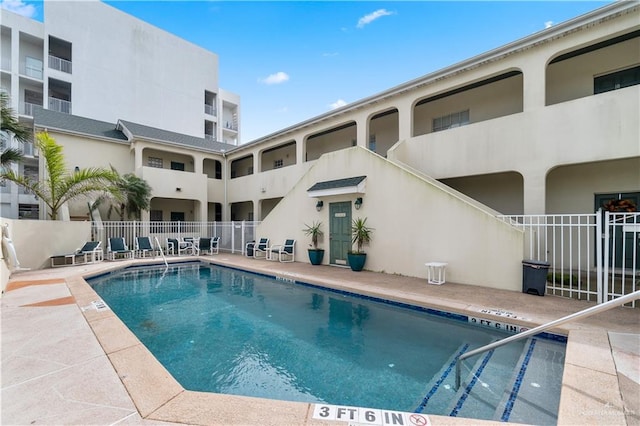 129 E Lantana St Unit 3, South Padre Island, TX 78597 - pool featuring fence and a patio