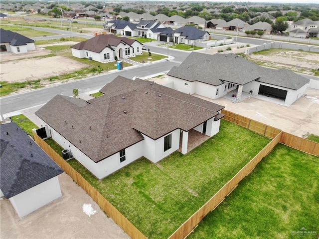 birds eye view of property with a residential view