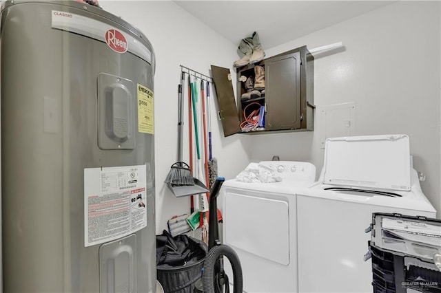 clothes washing area with laundry area, washing machine and clothes dryer, and electric water heater