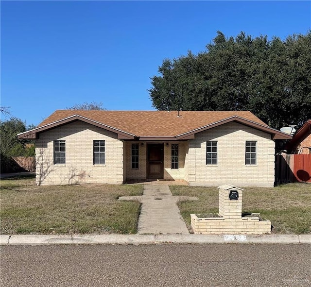 ranch-style house featuring a front lawn