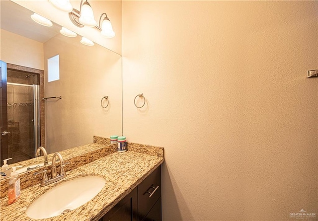 bathroom with vanity and an enclosed shower