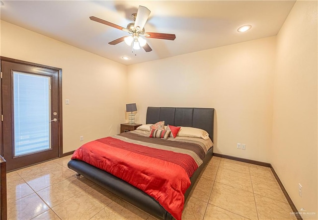 tiled bedroom featuring ceiling fan