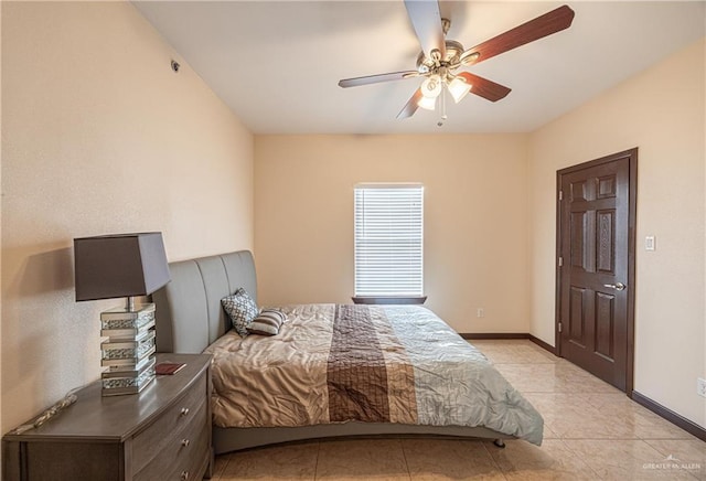 bedroom with ceiling fan and light tile patterned floors