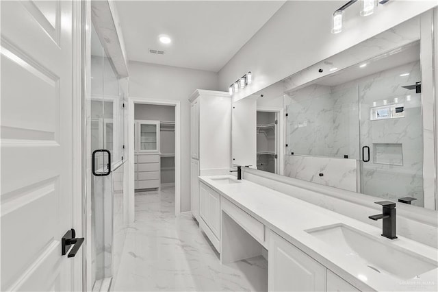 bathroom with vanity and an enclosed shower