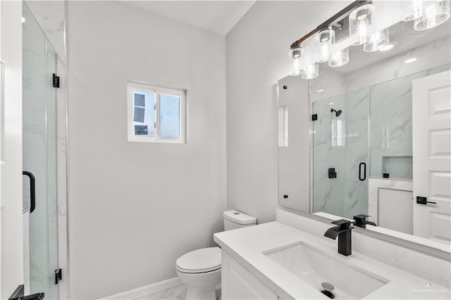 bathroom with vanity, toilet, and walk in shower