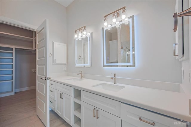8047 N 48th Ln, Mcallen, TX 78501 - full bathroom with double vanity and wood finished floors