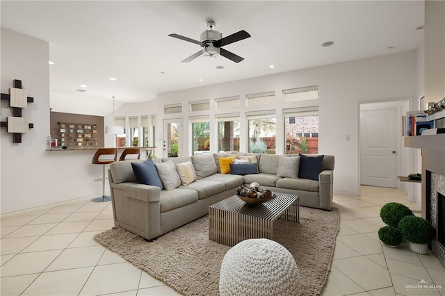 tiled living room featuring ceiling fan