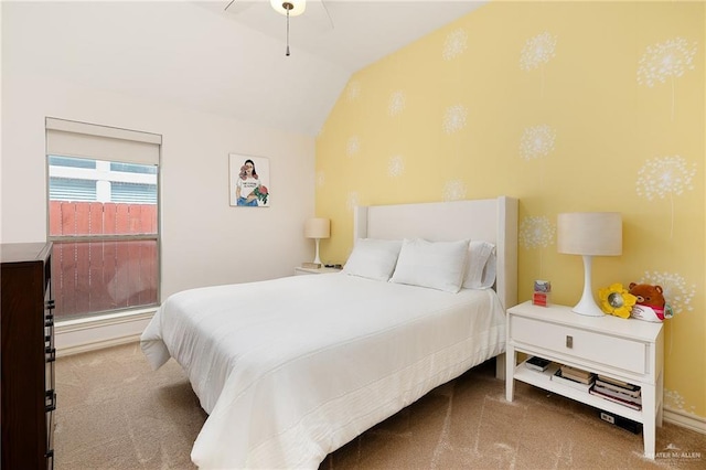 carpeted bedroom with vaulted ceiling