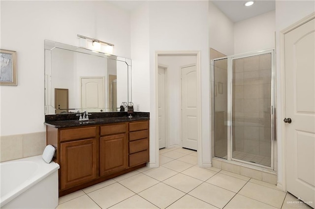 bathroom with vanity, separate shower and tub, and tile patterned floors