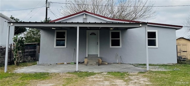 view of front of property with entry steps and stucco siding